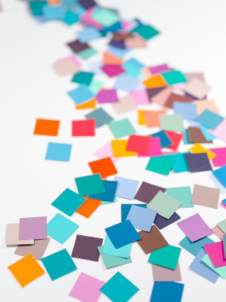 a white table topped with lots of colorful confetti
